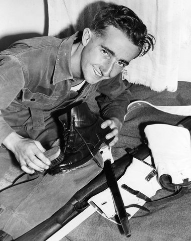 Lionel Cull of Thornbury polishing up his gear for the passing out parade at Point Cooke [i.e. Cook], c. 1954
