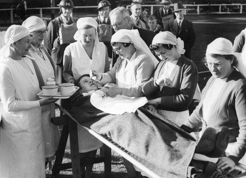 [Nurses attending casualty at the A.R.P. [i.e. Air Raid Precautions] demonstration at Malvern Cricket Ground], c. 1943
