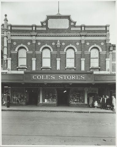 Exterior of Coles store with merchandise displayed in the windows priced from 7d. Coburg Store No. 21, 1947