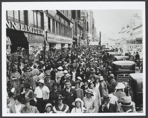 Looking east towards huge crowd in Bourke Street in front of Coles Variety Store in Deva House Melbourne Store No. 4, 1930–35