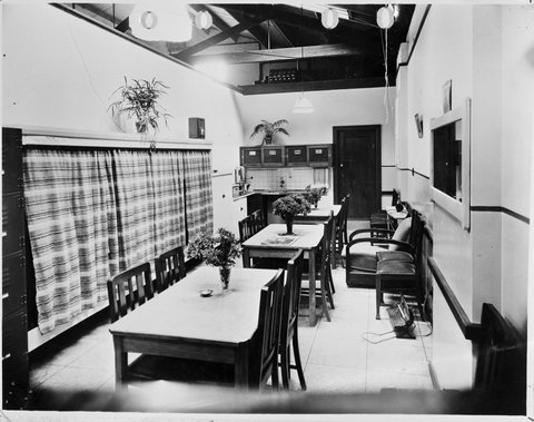 A possible staff tea room showing narrow room with tables and chairs and kitchenette at Prahran Coles Variety Store No. 2, 1940–50