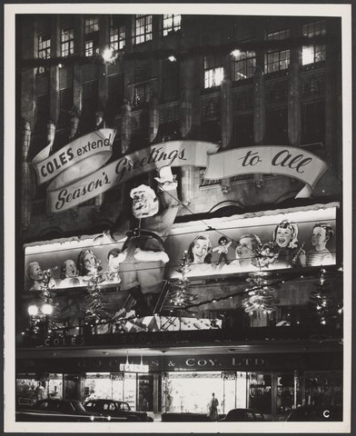Christmas decorations on exterior of Coles Bourke Street store with seasonally greetings message Store No. 12, 1954