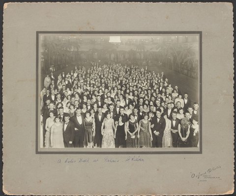 Elevated view of a large group of Coles Staff Ball at the Palais St Kilda, 1930