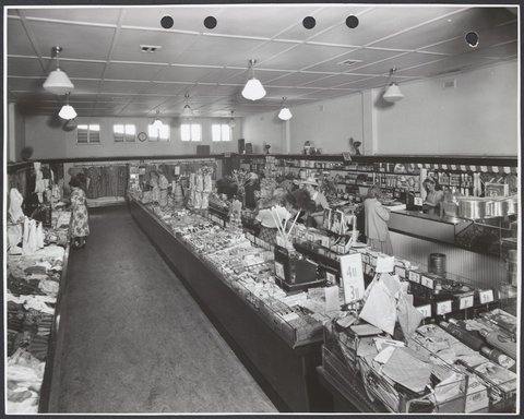 Interior showing female customers at counters displaying clothing and toiletries also a refreshment bar in Coles Frankston Store No. 118, 1945–49
