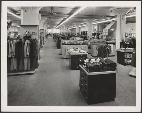 Ladies and children's clothing section with clothing on racks and counters, Mantons Bourke Street store, 1942–51