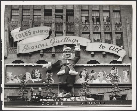 Christmas decorations on exterior of Coles Bourke Street store with seasonally greetings message Store No. 12, 1954