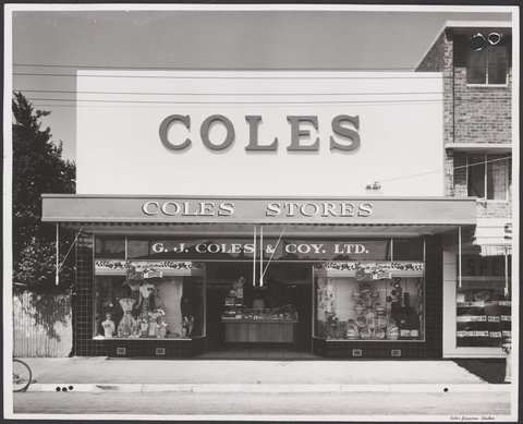 Shopfront window displays featuring women's clothing and cane baskets and decorated with Christmas greetings Mentone Store No. 181, 1953
