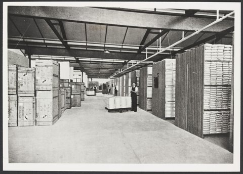 Merchandise Department section of Melbourne warehouse shows shelving and staff, 1930s
