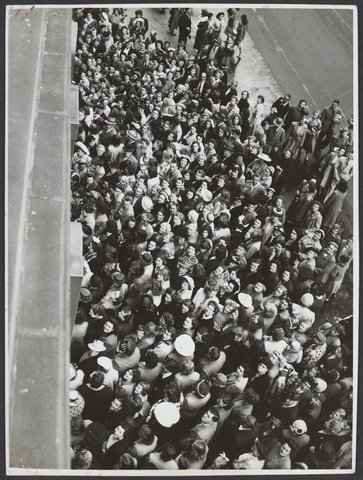 Large crowd of shoppers on footpath in front of Mantons Bourke Street, 1942–51