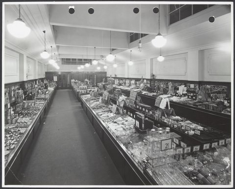 Elevated view of interior showing wide variety of goods on display counters in Coles Carnegie Store No. 50, 1947