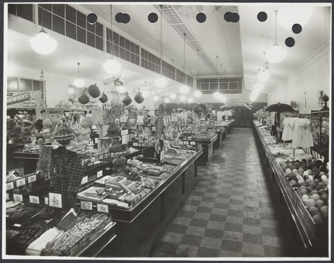 Elevated view of interior showing display counters of children's clothes wool and gifts in Coles Collingwood Store No. 1, 1936