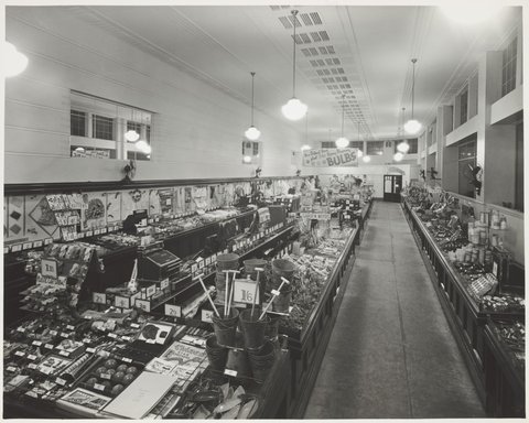 Interior of Coles store Hawthorn with a display of children's toys including buckets and spades and board games at Glenferrie Store No. 17, 1947