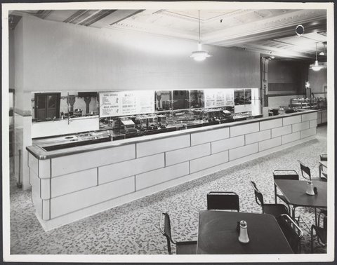Cafeteria showing tables chairs and counter with soda fountain in Coles Bourke Street Store No. 12, 1940–47