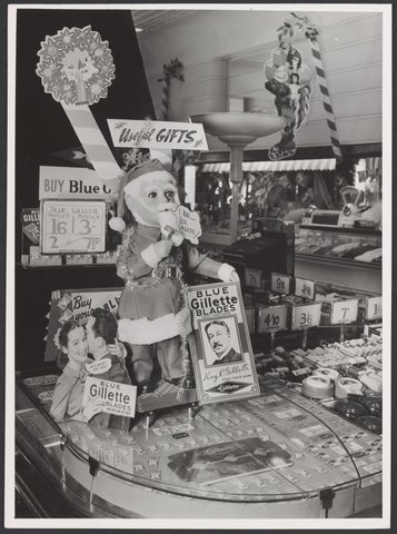 Interior of Coles Swanston Street store displaying Gillette blades and a model of Santa Claus with inscription 'I too use Gillette' Store No. 6, 1949