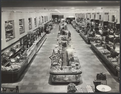 Interior of Coles store Bourke Street showing counters with merchandise on display including Colgate toothpaste for 2/4'd Store No.12, 1954