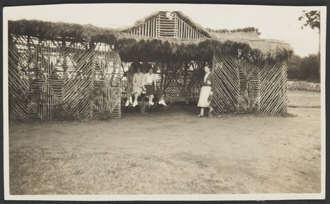 Five women in a shelter at Frankston with four wearing canvas sports shoes, 1930–40