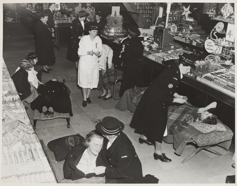 St. John Ambulance women giving first aid to people hurt in crush coronation of Elizabeth II Bourke Street Store No. 12, 1953