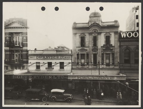 Row of shops taken early morning before opening time - site of old Coles Variety Queen Street Brisbane Store No. 24, 1930–32