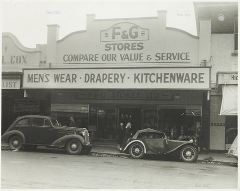 Street view with F & G Stores on parapet and vehicles parked at curb Coles Box Hill Store No. 44, 1930s