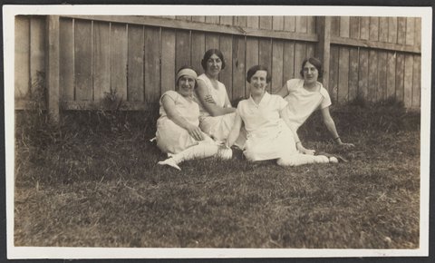 Jean Mill & Ethel and Lois Rogers sitting on grass near a wooden fence at Punt Road South Yarra, 1930–40