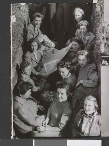 Air raid alerts in Melbourne during World War II - group in an air raid trench, c. 1942