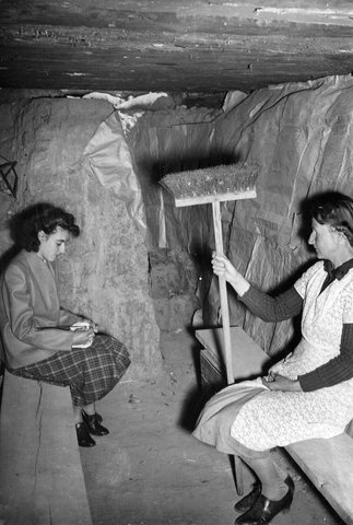 Two women sitting in an under-ground shelter, West Brunswick, Melbourne, 1938–44