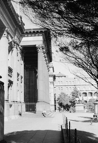 Two men on steps of State Library of Victoria, Melbourne, 1954