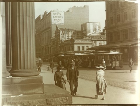 Melbourne street scene, showing premises of Alcock & Co., pedestrians and trams, 1880–1938
