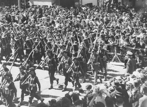 Military procession in Melbourne, near the corner of Elizabeth and Collins Streets, 1943