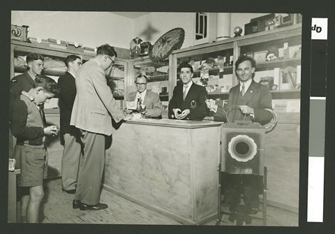 Group of men and a boy in a magic shop [Bernard's Magic Shop, Melbourne?], 1940–54