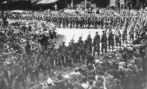 Military procession in Melbourne, near the corner of Elizabeth and Collins Streets, 1943