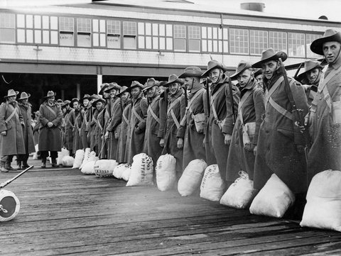 Men of the 2nd contingent of the 2nd A.I.F. wait on the deck before embarking at Port Melbourne, c. 1940