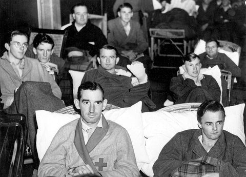 Patients wearing dressing gowns enjoy a concert at St John Hall, Heidelberg Military Hospital, 1940–45