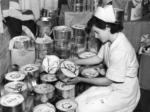 Miss Judith Cook of Murrumbeena with some of the 100 cakes baked by the Emily Mcpherson College for Britain, c. 1945