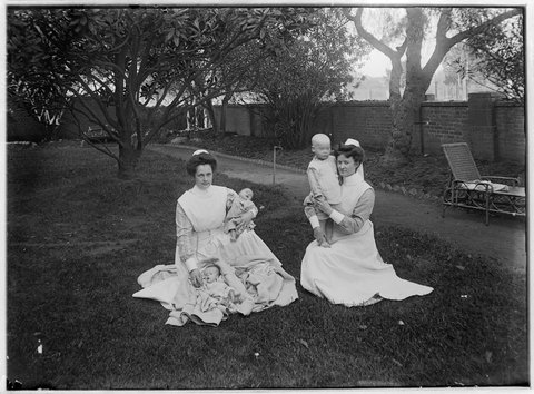 Nurses with babies, possibly in the red-walled garden of the Children's Hospital, Rathdowne Street, Carlton, 1890–1900