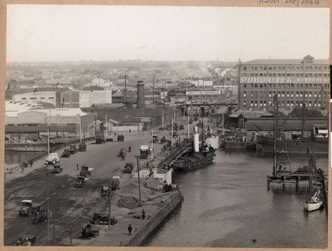Tug Racer, which was blown by wind against bridge, slightly damaging stonework at one end of pier, [Spencer Street Bridge, Melbourne, Vic.], 1927–28