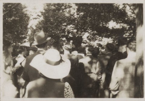 Group of people listening to man with raised fist, possibly on the Yarra Bank, Melbourne, 1939–45