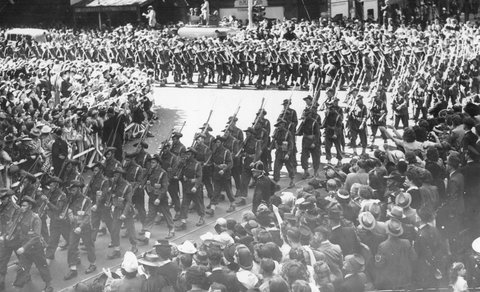 Military procession in Melbourne, near the corner of Elizabeth and Collins Streets, 1943