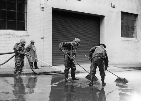 Air Raid Prevention Decontamination Squad wash down street during simulated gas attack in Melbourne, 1936–42