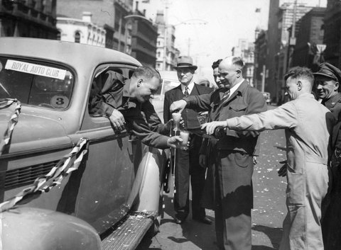 Liquid hospitality being dispensed on route to Flemington, c. 1945