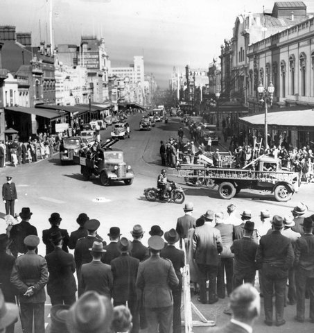 Trucks of civil defence units parade, Bourke Street, Melbourne, c. 1943