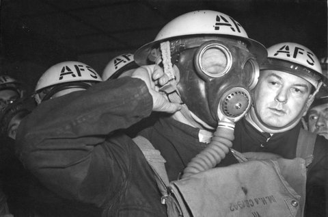 Members of the South Melbourne Auxiliary Fire Service learning use of the gas mask, 1939–45