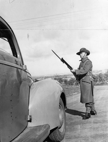 Soldier on guard duty at Royal Park military camp, c. 1940