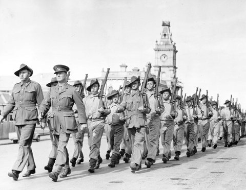 Setting out on a route march through Dandenong with the Post Office in the background, c. 1940