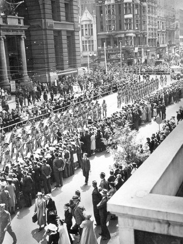 Soldiers marching through Melbourne streets, watched by large crowd, 1938–44
