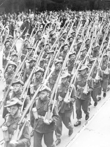 Elevated view of 2nd A.I.F. marching along Melbourne city street, 1939–44