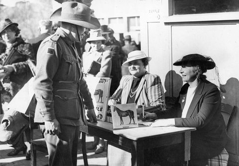 Raffling racehorse tickets at Flemington, c. 1940